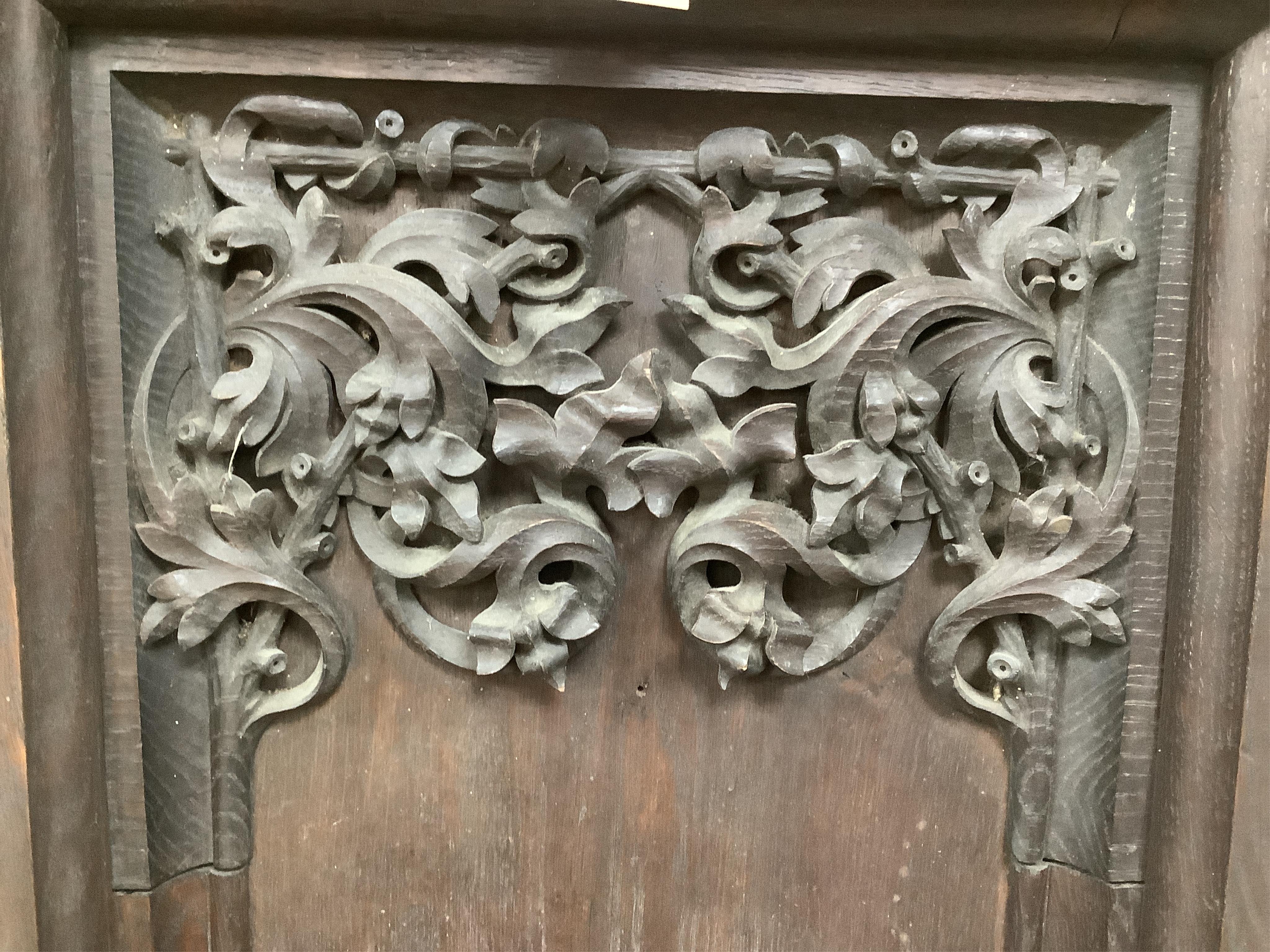 A 19th century Gothic revival carved oak wall bracket carved with Gothic tracery and the head of Moses, height 86cm, width 41cm. Condition - good